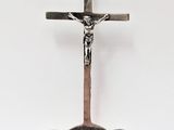 a silver spoon with a cross on it and a spoon in the shape of a cross
