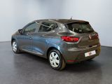the rear end of a grey car in a showroom