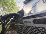 a close up of a machine that is sitting in the grass