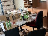 an image of a messy office with a lot of clutter on the desk