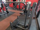 a gym room with a row of machines in it