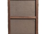 an old wooden frame with a linen cover on it