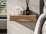 a bed with a wooden shelf on it next to a window