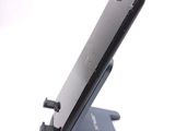a cell phone that is sitting on top of a stand