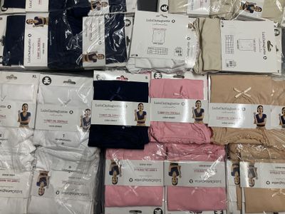 many different types of men ' s clothing on the table