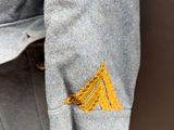 a close up of a jacket hanging on a wall