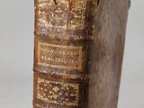 an old book sitting on top of a wooden table