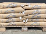 many bags of adult concrete sitting on a pallet