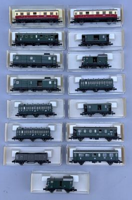 a lot of different model trains on display in a box