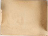 a piece of brown paper on a white surface