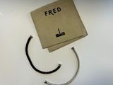 a brown box with a rope on it and the word fred written on it
