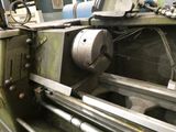 a machine that is working on a piece of metal