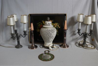 a picture of a picture of a vase and candles on a table