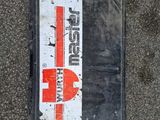 a sign on the ground that says pepsi on it