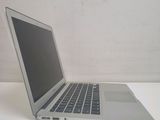 a laptop computer sitting on a table with a white background