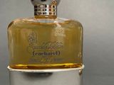 an image of a bottle of perfume on a table