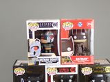 several batman pop vinyl figures are stacked on top of each other