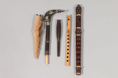 three different types of musical instruments on a white surface