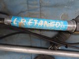 a close up of a bike with graffiti on the handlebars