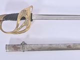 two swords that are laying side by side on a white surface