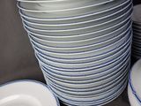 many plates stacked on top of each other on a table