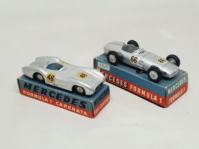 two toy cars that are sitting on top of each other