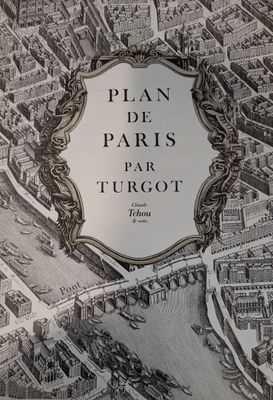 une vieille carte de Paris avec, au centre, une illustration représentant une ville