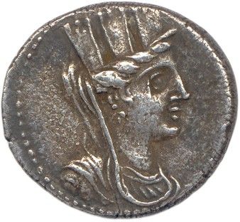 une pièce d'argent sur laquelle figure l'effigie d'une femme coiffée d'un chapeau