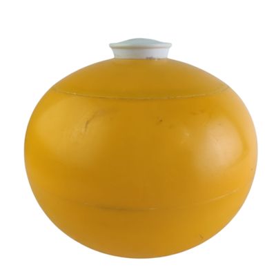 a yellow ball with a white top on a white background