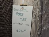 a label on a dress with a price tag attached to it