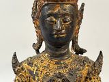 statue of a woman holding a bird in her right hand