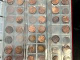 a lot of coins in a plastic container on a table