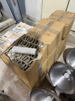many pots and pans sitting on the floor next to each other