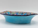 blue bowl with a floral design on the rim