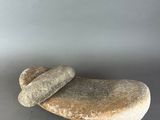 two large rocks sitting on top of a table next to each other