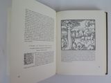 an open book with a picture of a man in the woods