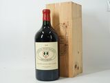 a bottle of wine sitting next to a wooden box