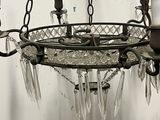 a chandelier made of glass hanging from a chain