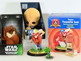 a box of toys and a toy figure on a table