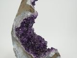 a close up of a piece of rock with purple crystals on it