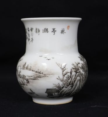a white vase with asian writing on it on a black background