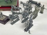 a lot of figurines that are sitting on a table