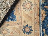 an image of a blue and beige rug with a black border