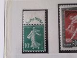 four different stamps are on display in a white frame
