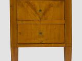 an image of a small wooden chest of drawers on a white background