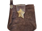 a close up of a brown bag with a star on it