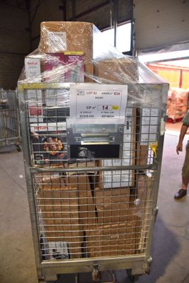 a metal cart with boxes on top of it in a warehouse