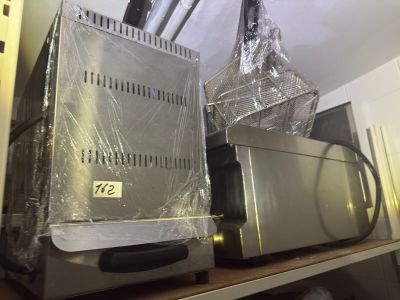 a microwave and a toaster on a shelf in a kitchen