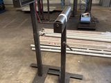 a picture of a bench in a factory with a machine in the background