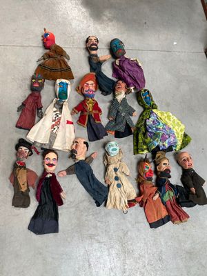 a lot of dolls that are laying on the floor